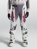 Alpinestars calças Supertech Swan Juventude, calças de motocross, cinzentas e lilás com pormenores vermelhos.