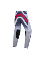 Calças de motocross Alpinestars Juventude Supertech Swan, cinzentas e vermelhas, vista traseira e ajuste atlético.