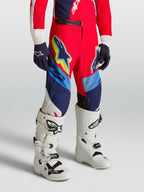 Calças Alpinestars Supertech Dyna Juventude, equipamento de motocross vermelho e azul-marinho em tecido rip-stop elástico.