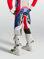Alpinestars Supertech Dyna, calças de motocross para juventude, vermelhas e azul-marinho, vista traseira com ajuste atlético