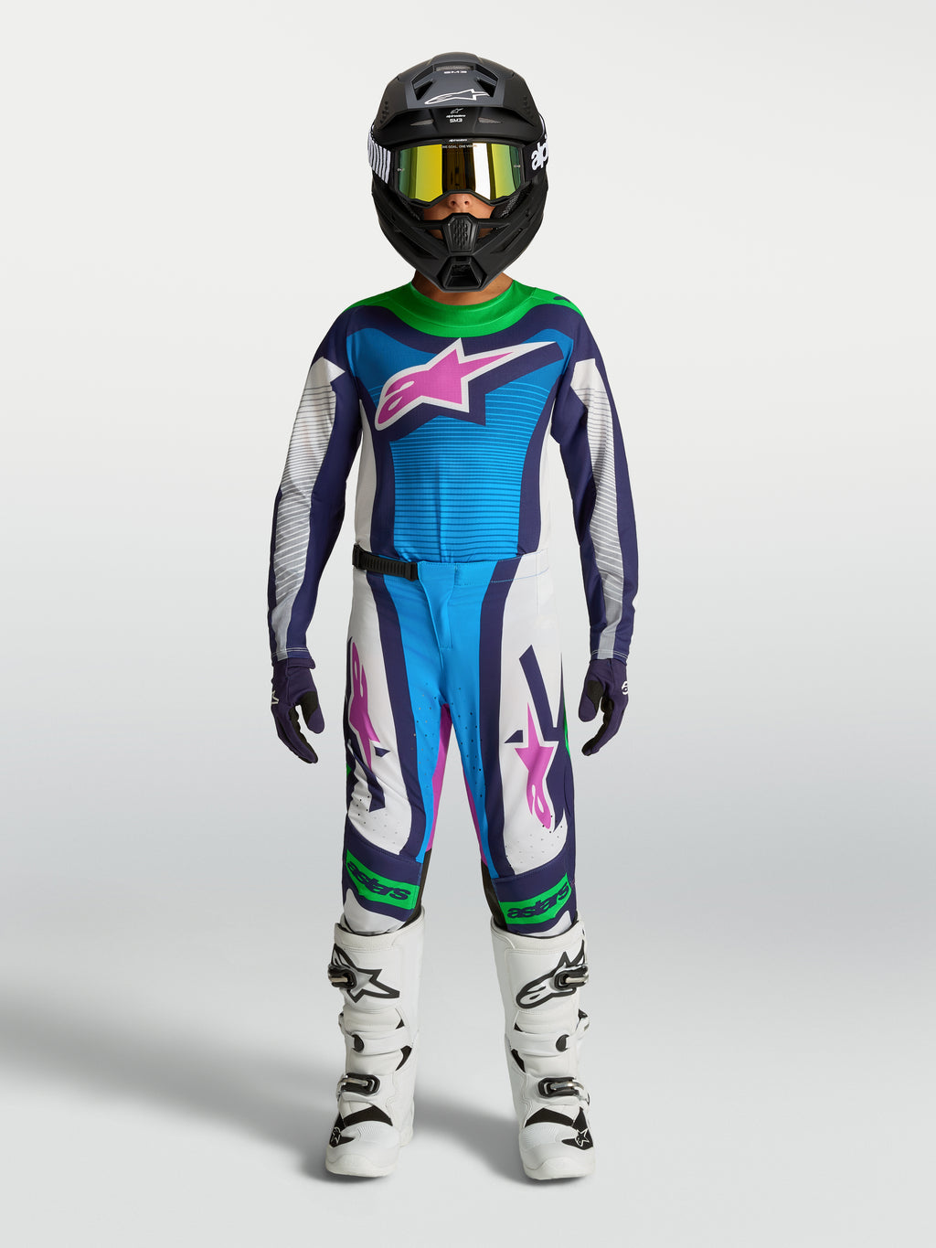 Alpinestars Supertech Maven Juventude, camisola e calças de motocross azuis e brancas, verde fluorescente, ajuste atlético.
