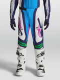 Calças Alpinestars Supertech Maven Juventude, brancas e azuis com detalhes verde fluorescente e ajuste atlético.