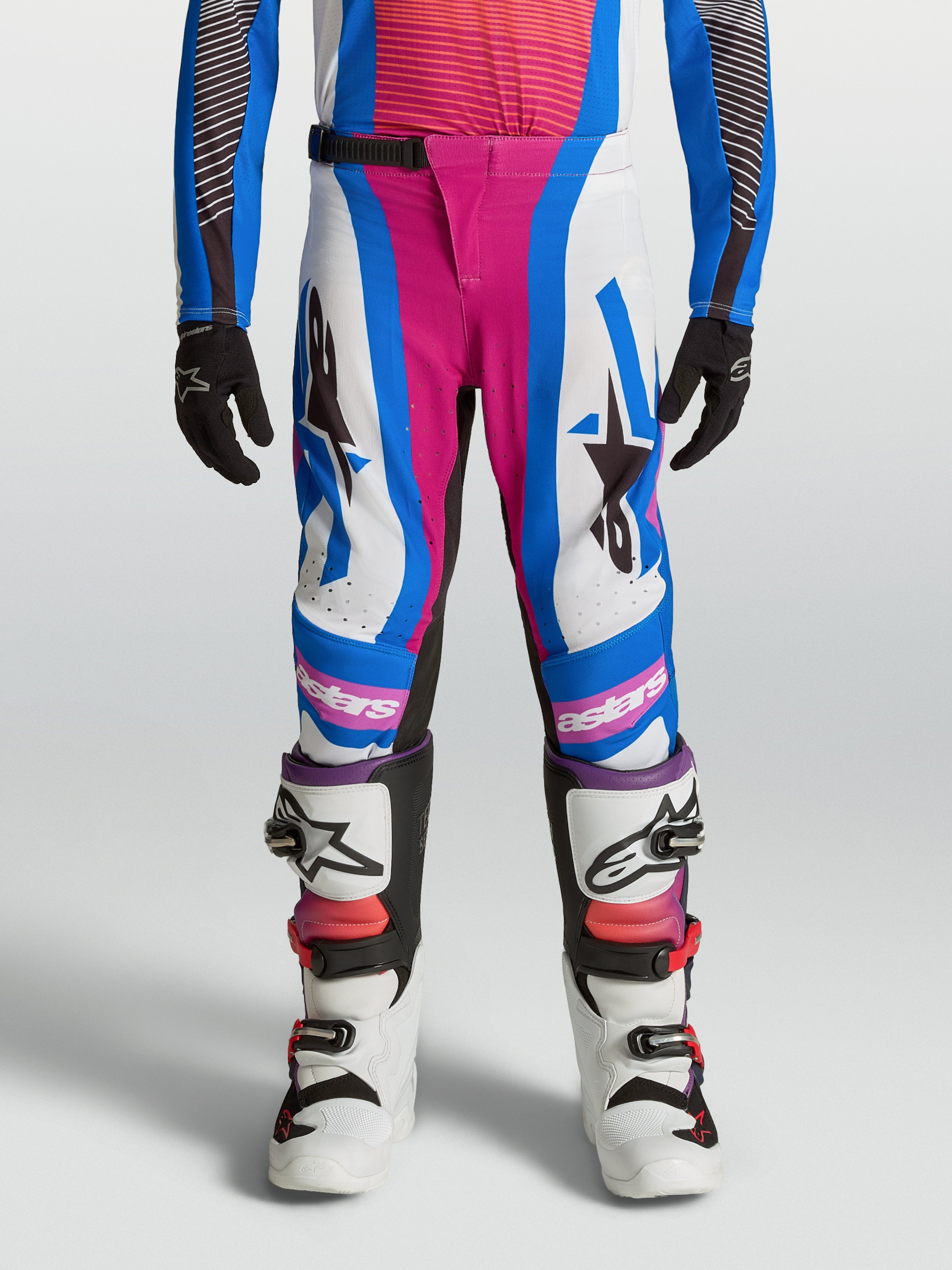 Alpinestars Supertech Maven juventude, calças de motocross brancas e hot coral, com ajuste elástico e durabilidade.