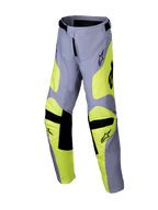 Alpinestars 2025 Youth Racer Veil Pants, calças de motocross, cinzentas e amarelo néon, detalhes pretos nos joelhos e na cintura, design desportivo com pernas pré-curvadas e logótipos, equipamento de corrida off-road durável