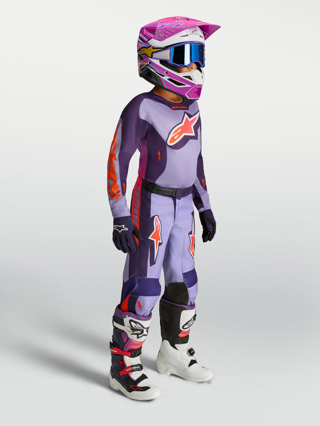 Alpinestars Calças Fluid Hunt Juventude, conjunto de motocross roxo e violeta para jovens com camisola, capacete e botas.