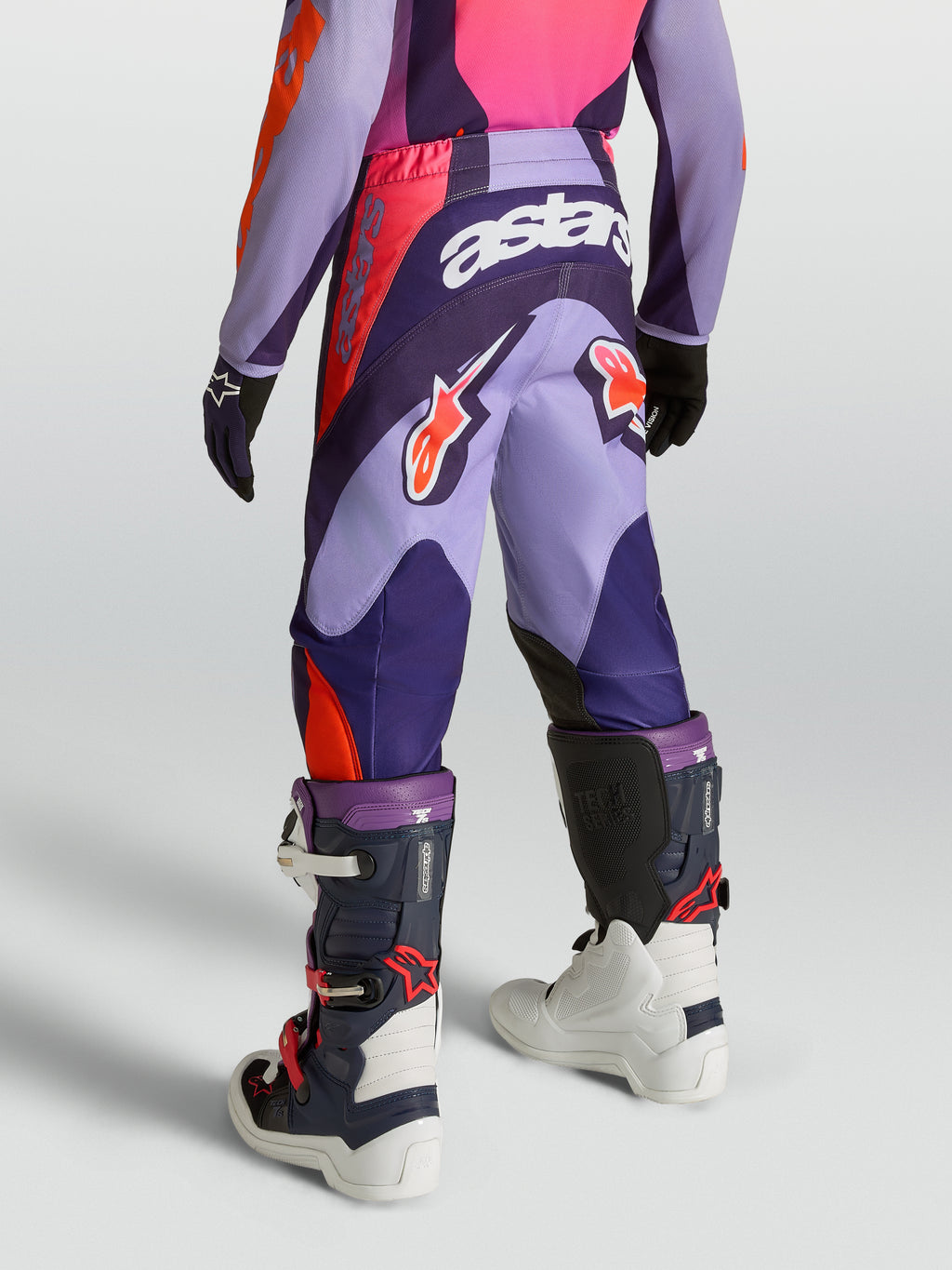 Alpinestars Youth Fluid Hunt, calças de motocross para jovens, roxas e rosa, vista traseira, material polifabric 600D.
