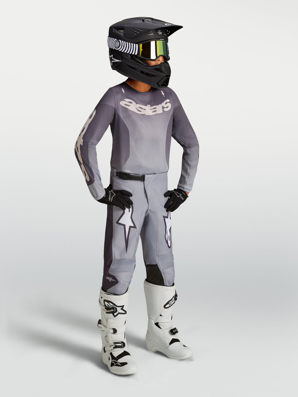 Calças Alpinestars Fluid Amber Juventude, areia e branco, ajuste desportivo para motocross com grafismos de estrela.
