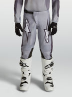 Alpinestars Fluid Amber, calças de motocross para juventude, cinzentas e pretas, ideais para todo-o-terreno.