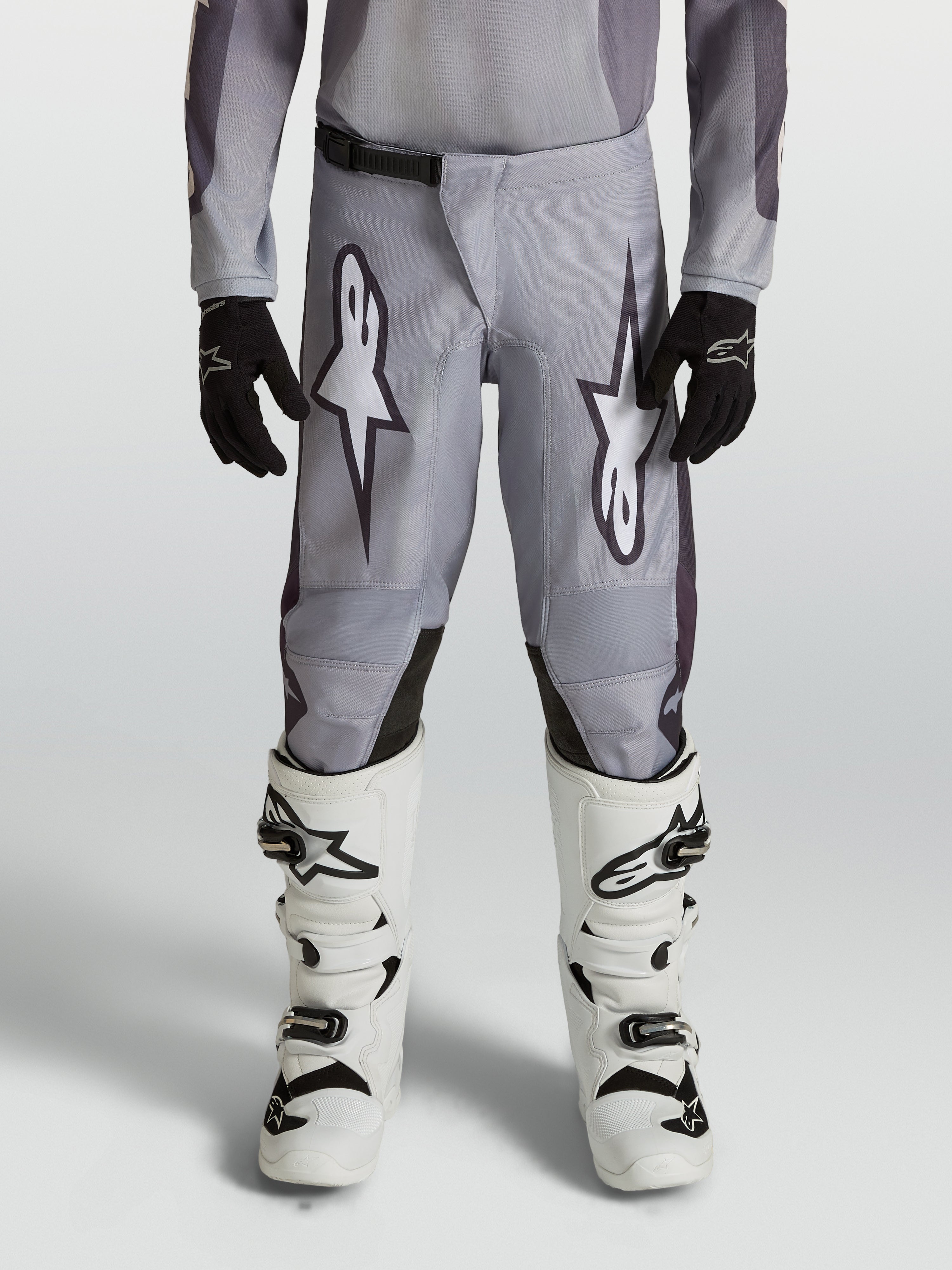 Alpinestars Fluid Amber, calças de motocross para juventude, cinzentas e pretas, ideais para todo-o-terreno.