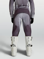 Alpinestars Calças Fluid Amber Juventude 2027, calças de motocross cinzentas e areia, assento reforçado e painéis ergonómicos.