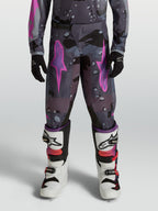 Alpinestars calças Fluid Lone juventude, calças de motocross, cinzentas camufladas e roxas, em polifabric 600D durável.