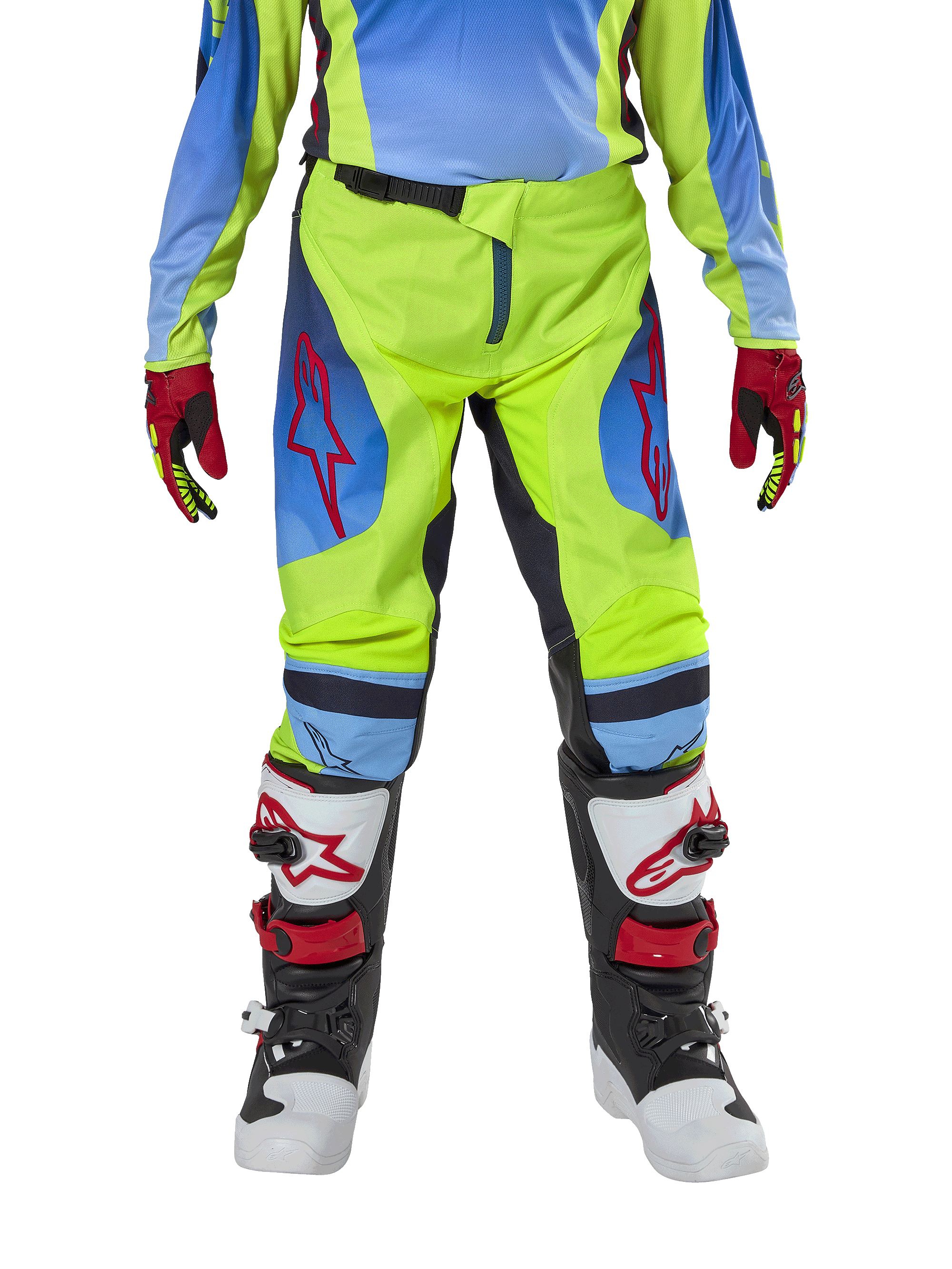 Alpinestars Youth 2024 Racer Hoen Pants, calças de motocross, amarelo néon e azul Night Navy, com logótipos de estrela vermelhos nas coxas, usadas com camisola a condizer, luvas vermelhas e pretas, e botas de motocross brancas, pretas e vermelhas, equipamento resistente para todo-o-terreno