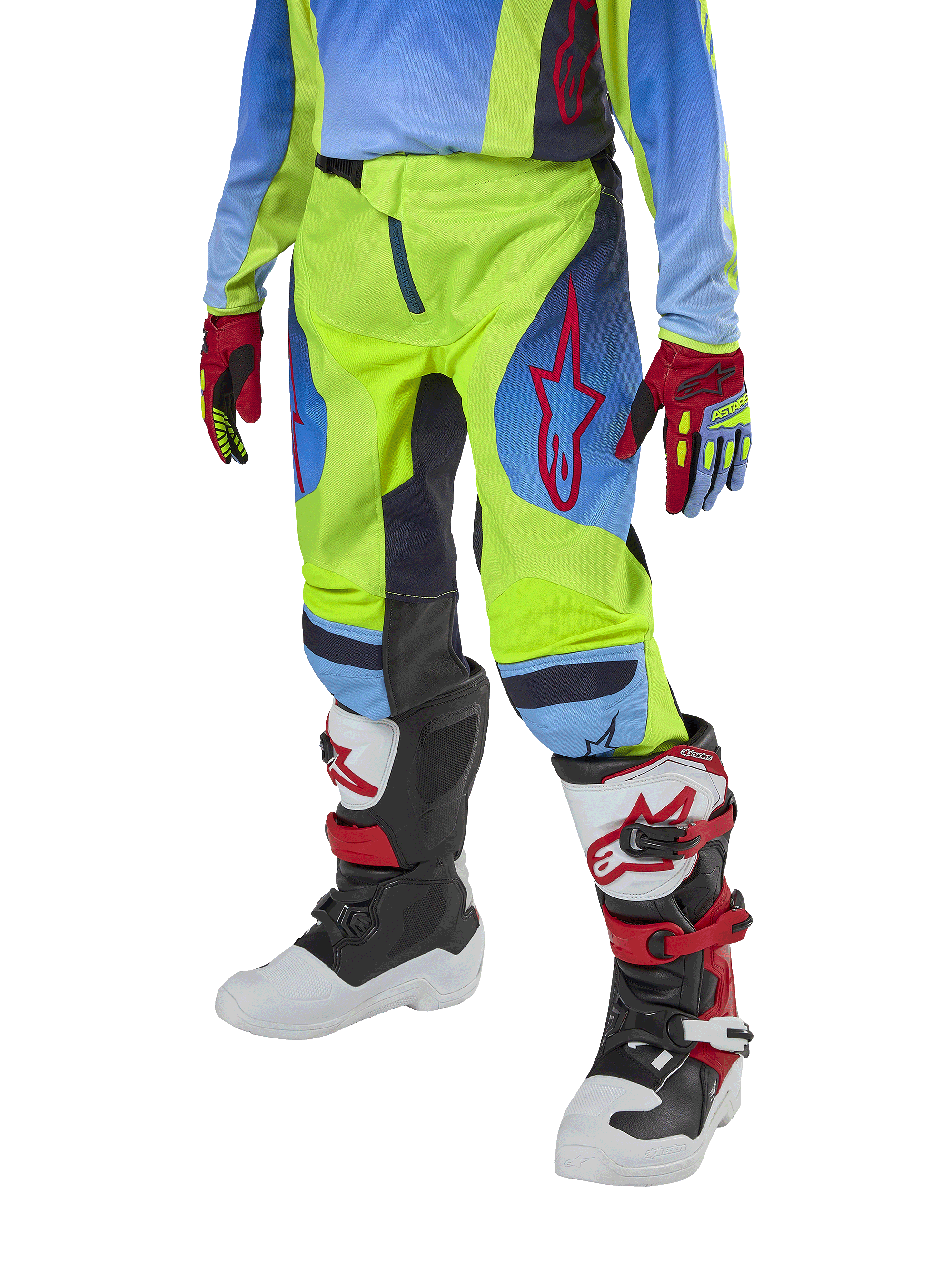 Alpinestars Youth 2024 Racer Hoen Pants, calças de motocross para jovens, amarelo néon e azul marinho com detalhes vermelhos, usadas com luvas a condizer e botas brancas, pretas e vermelhas, com um corte desportivo e pernas pré-curvadas para corridas de todo-o-terreno