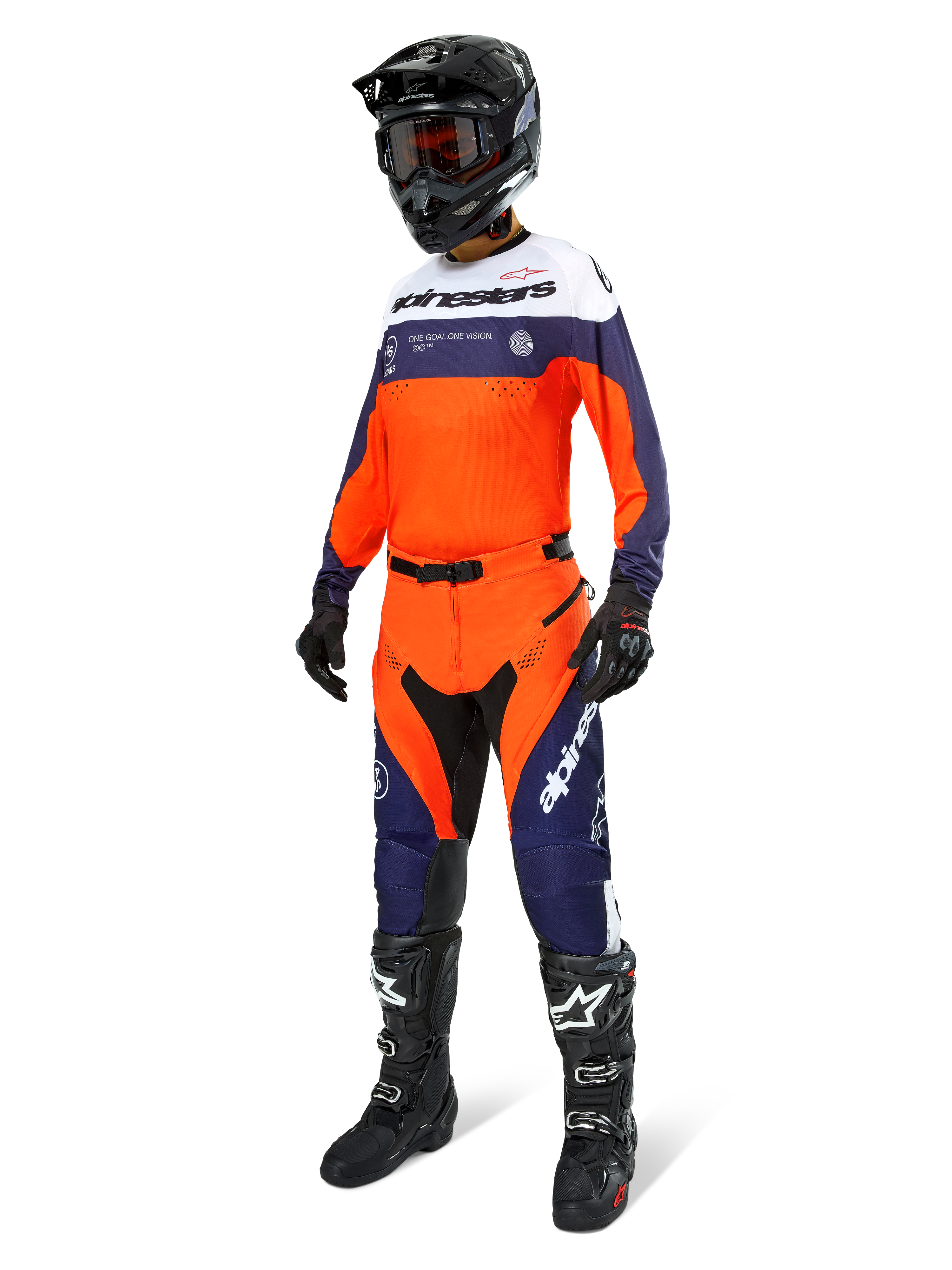 Motocross rider wearing the Alpinestars Pro-Dura Jersey in Navy, Hot Orange, and White, coordinating off-road pants, black helmet with goggles, and black boots, complete professional gear set for enduro and trail riding.