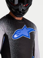 Alpinestars Supertech Hiten AFD, camisola de motocross para homem, preta e azul, com aberturas de ventilação cortadas a laser.