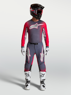Camisola Supertech Hiten AFD Alpinestars em cinzento e vermelho fluo, equipamento de motocross ventilado com ajuste atlético.
