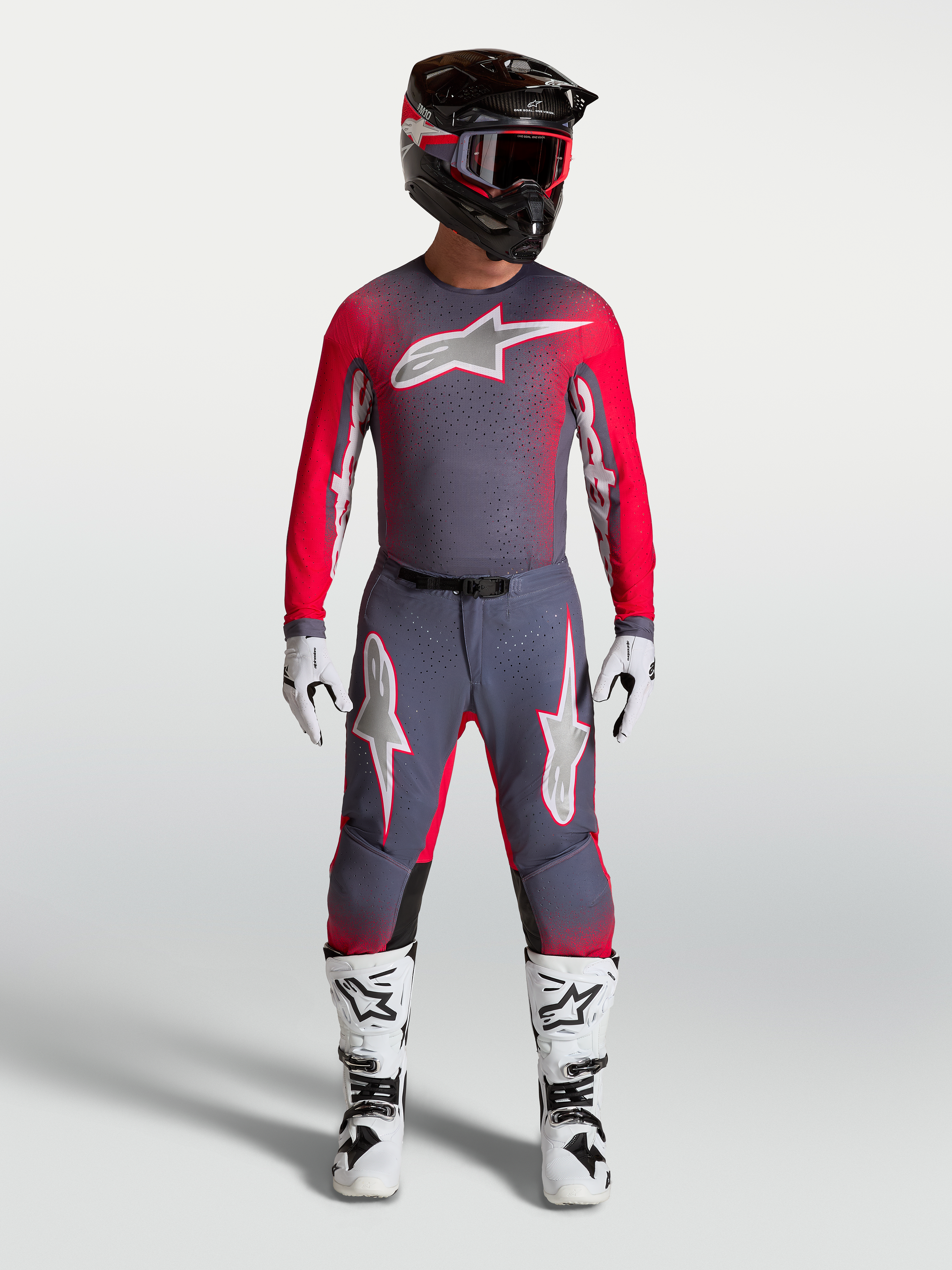 Camisola Supertech Hiten AFD Alpinestars em cinzento e vermelho fluo, equipamento de motocross ventilado com ajuste atlético.