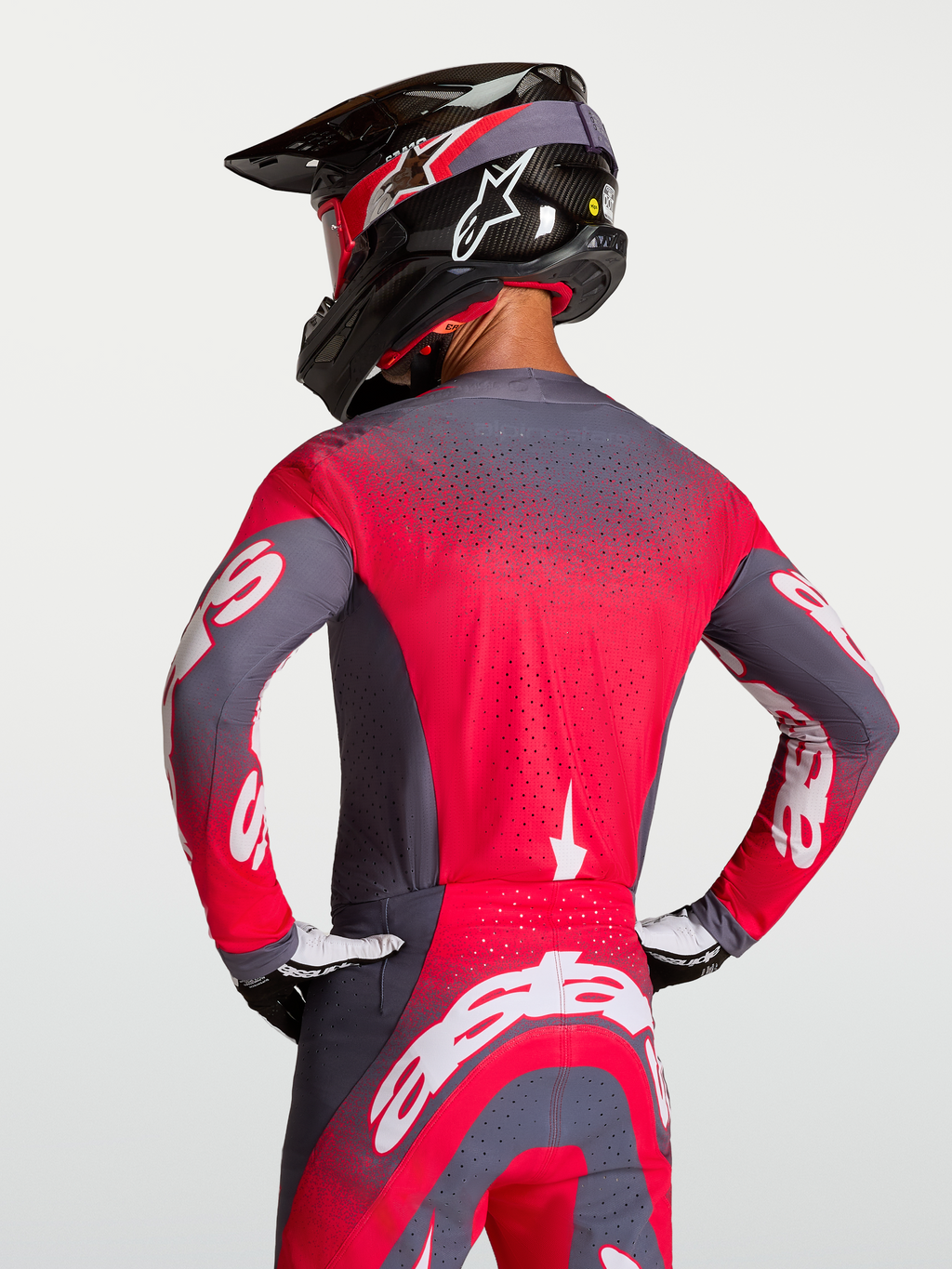 Alpinestars Camisola Supertech Hiten AFD, camisola de motocross em cinzento e vermelho fluorescente, com ventilação Stretchnet e ajuste atlético profissional.