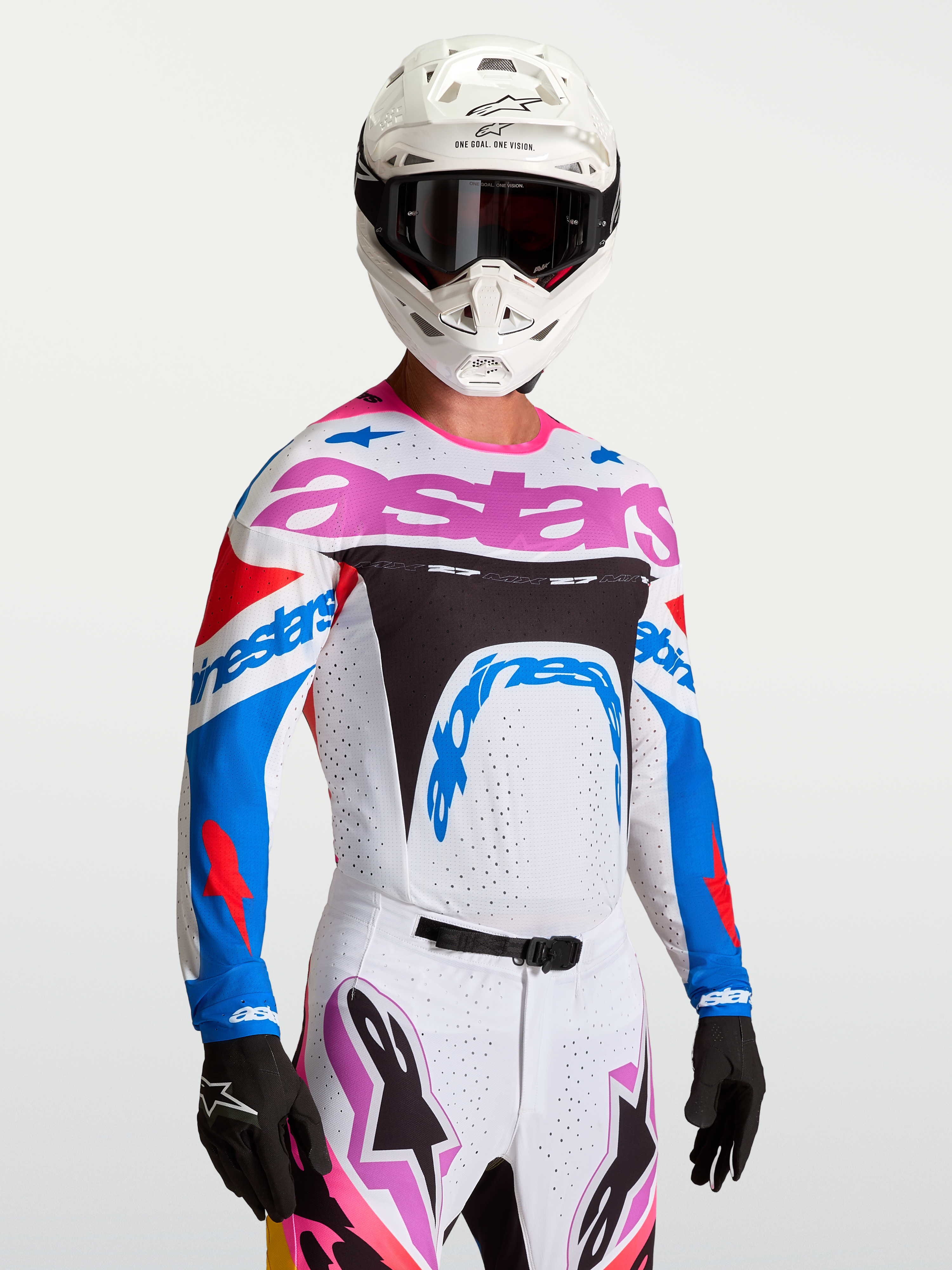 Alpinestars Supertech Dyna, camisola de motocross de nível profissional, branca e azul com detalhes roxos, fabricada em malha elástica para performance em pista.
