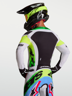 Camisola Supertech Dyna da Alpinestars, camisola de motocross para homem, verde fluo e preta, com malha elástica respirável.