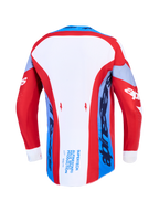 Alpinestars Supertech Dyna, camisola de motocross, vermelha, branca e azul-marinho, vista traseira com bainha prolongada.