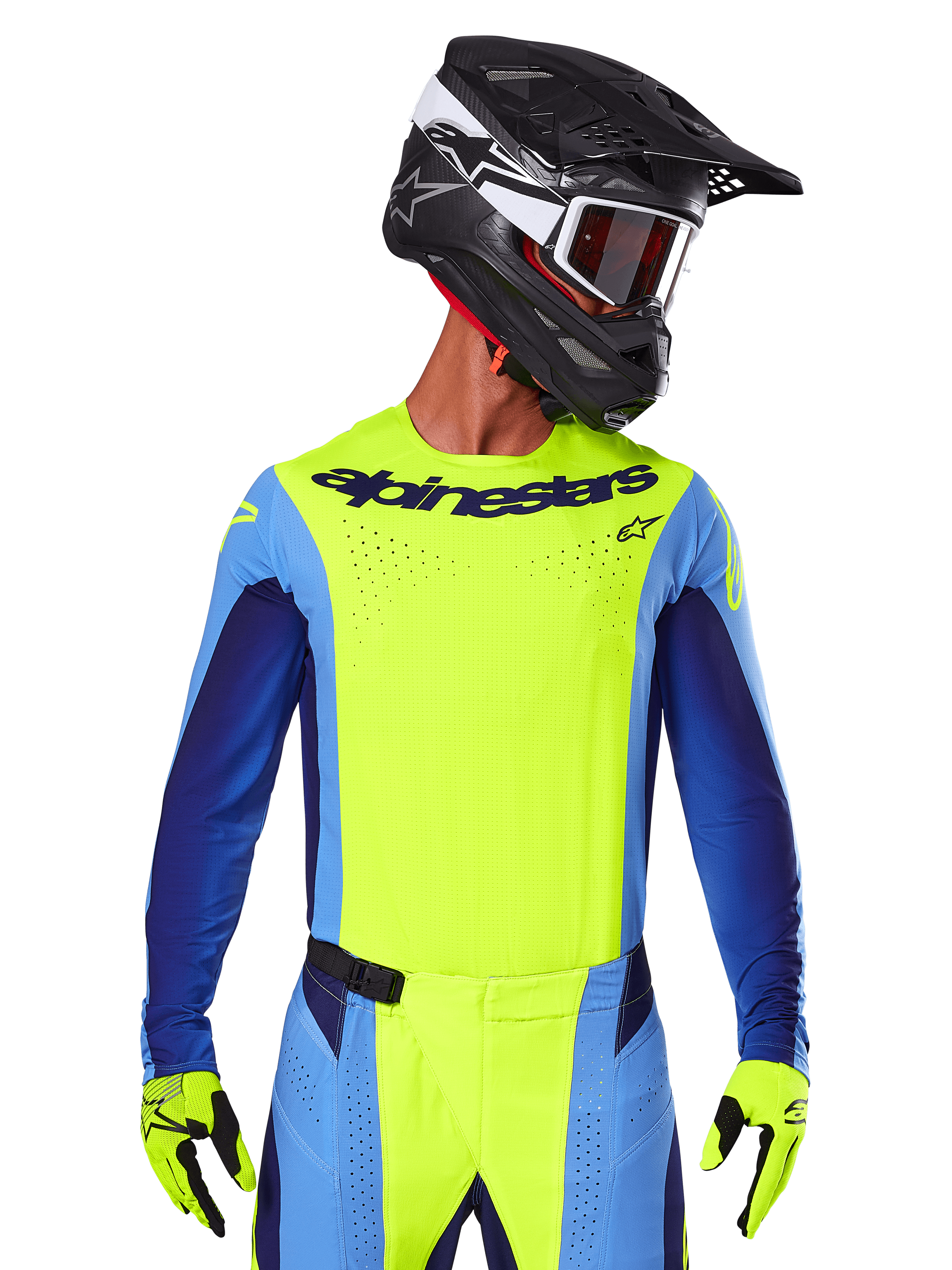 Camisola Techstar Melt 2025, camisola de motocross, amarelo fluo e azul, com ventilação cortada a laser e ajuste de corrida, usada por um piloto com capacete preto e luvas amarelo fluo