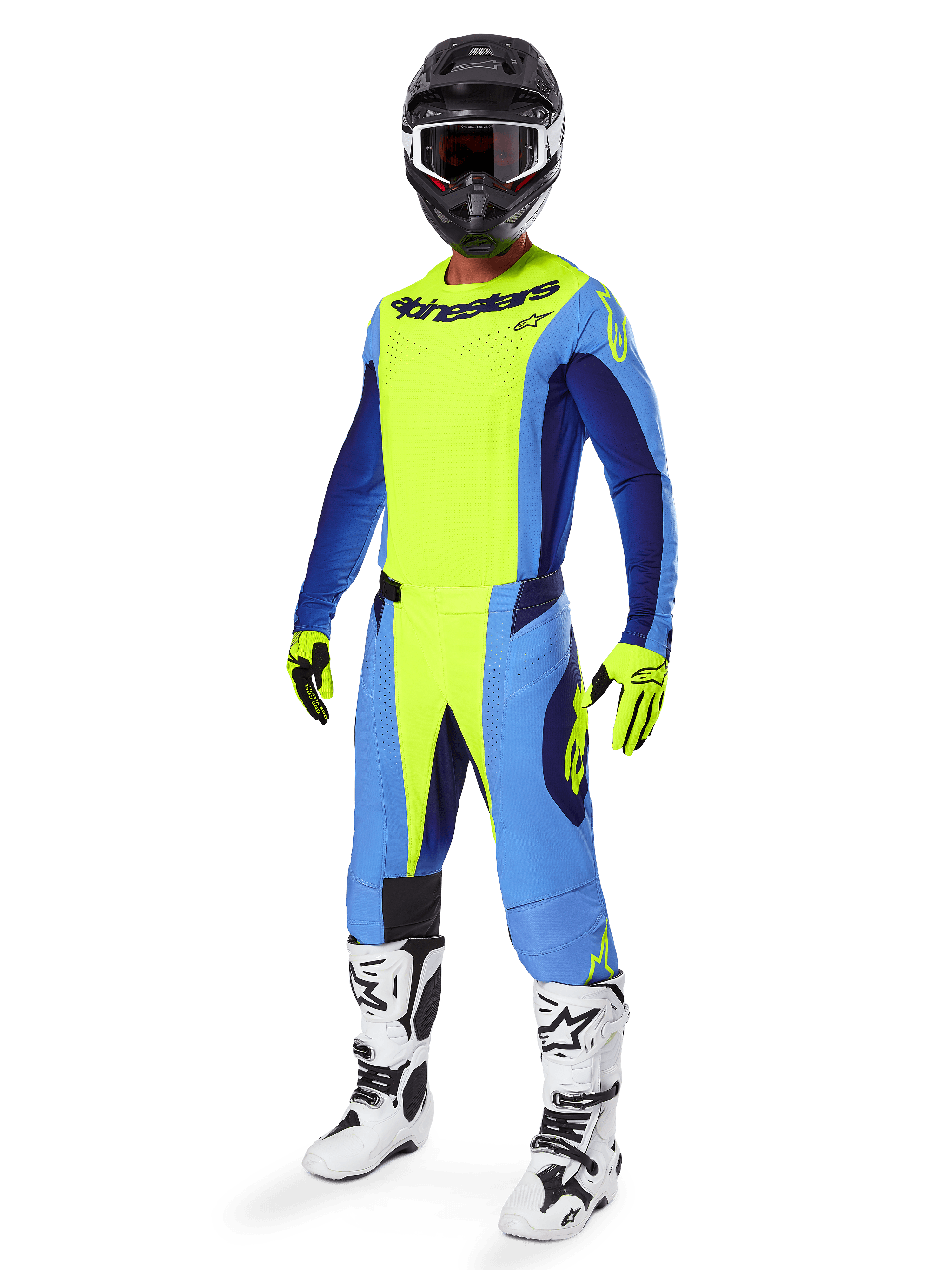 Piloto de motocross a usar a camisola Alpinestars 2025 Techstar Melt, Amarelo Fluo e Azul, combinada com calças a condizer, capacete preto com óculos, luvas amarelas e botas brancas e pretas, equipamento de performance completo para corridas todo-o-terreno