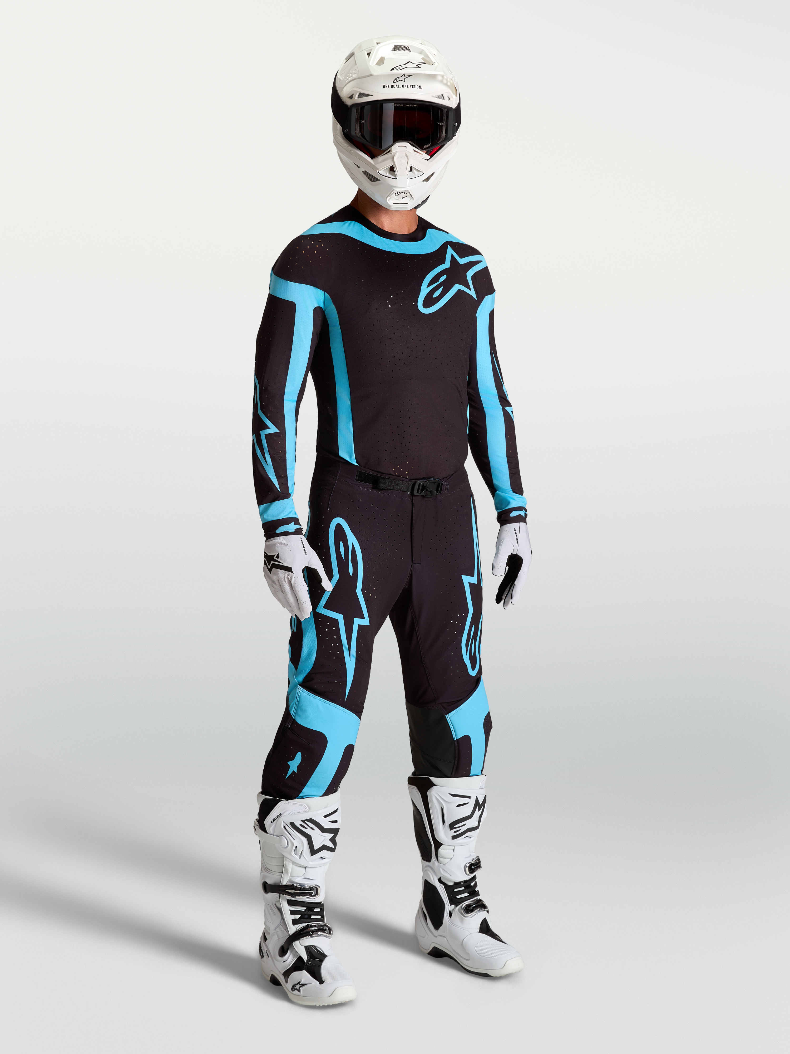 Alpinestars Camisola Supertech Vesta e Supertech Vesta Gear Set, conjunto de motocross, preto e turquesa, com ajuste atlético de corrida.