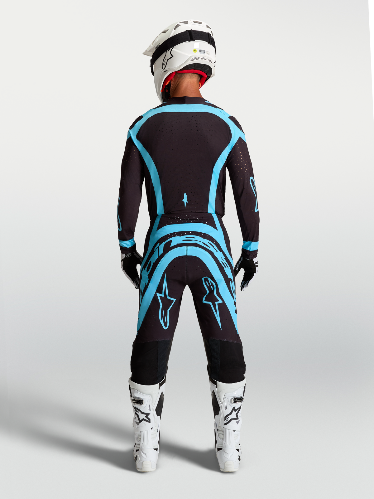 Alpinestars Supertech Vesta Jersey and Gear Set, professional black and turquoise motocross racing outfit with athletic fit.