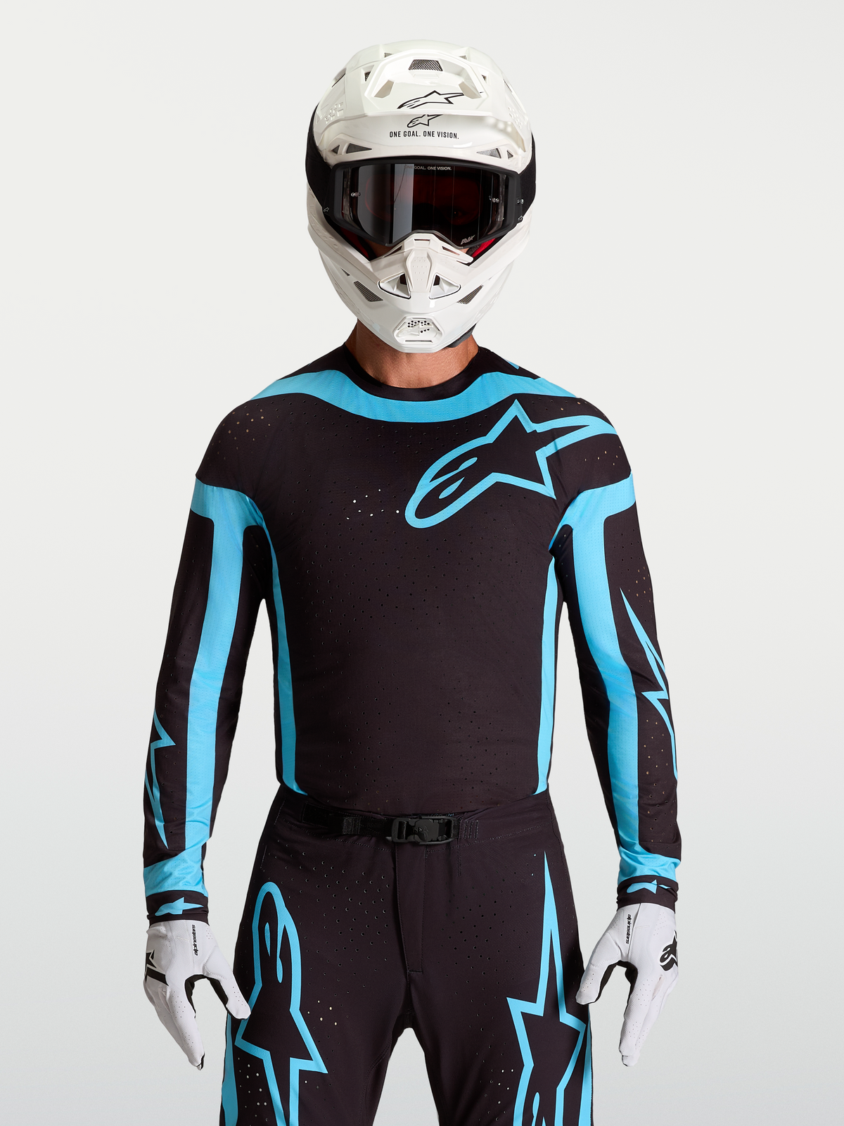 Alpinestars 2027 Supertech Vesta Jersey, men's black and turquoise motocross racing top with laser-cut stretch mesh panels.