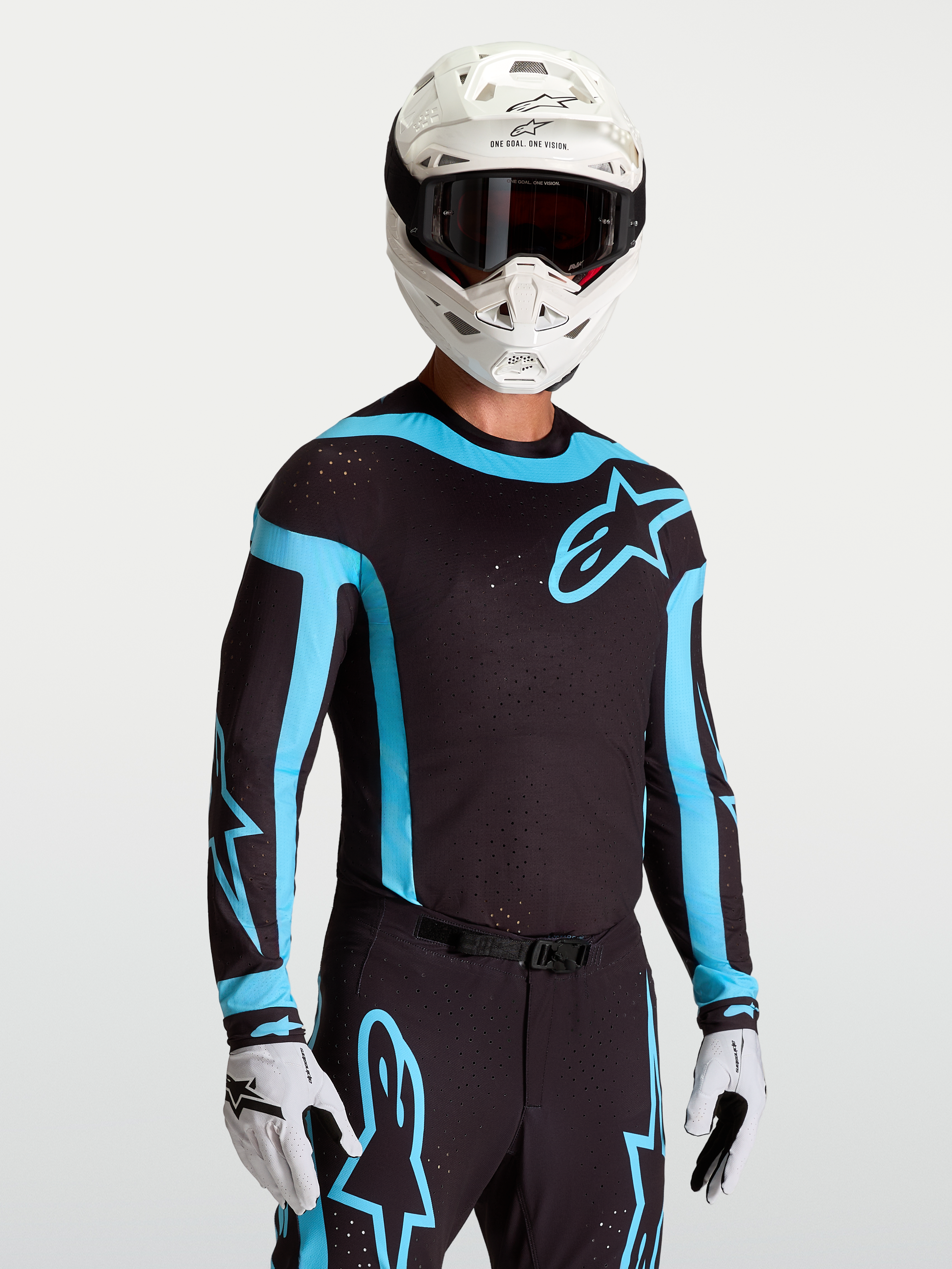 Alpinestars Supertech Vesta, camisola de motocross para homem, preta e turquesa, com ventilação a laser e ajuste atlético.