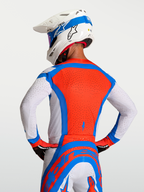 Alpinestars Supertech Vesta, camisola de motocross para homem, vermelha e azul com perfurações a laser respiráveis.