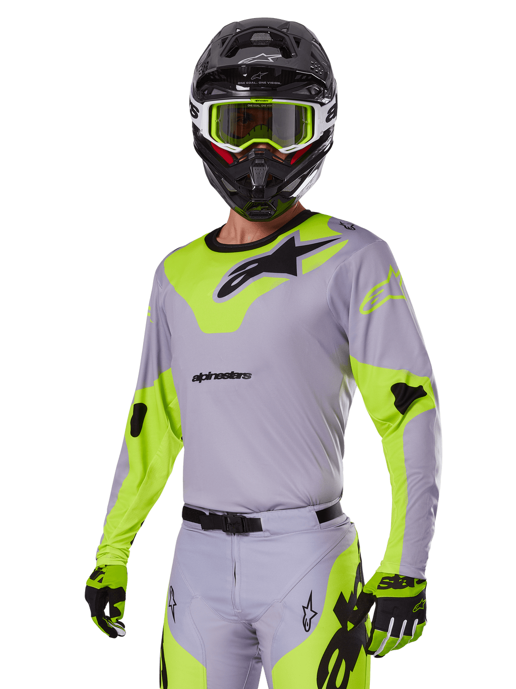 Piloto de motocross a usar o conjunto de equipamento Alpinestars Racer Veil 2025 em cinzento e verde néon, camisola e calças cinzento claro com painéis vibrantes em amarelo-verde néon e logótipos Alpinestars pretos, coordenado com luvas a condizer e capacete preto com óculos verde néon, vestuário profissional de corrida todo-o-terreno