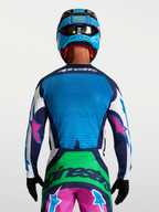 Camisola Alpinestars Techstar Maven, camisola de motocross para homem, azul e verde com detalhes rosa, vista traseira, ventilação perfurada a laser.