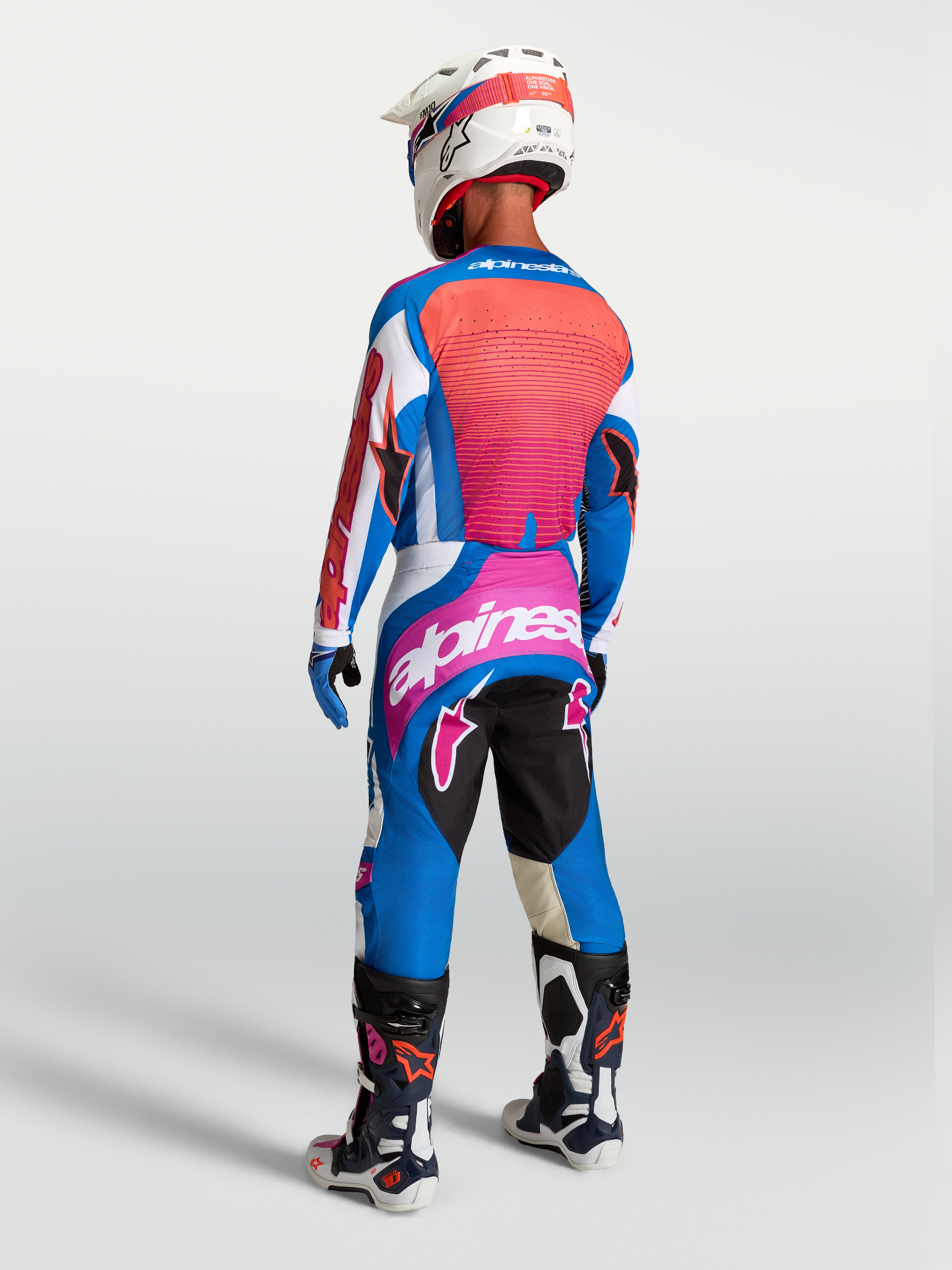 Alpinestars camisola Techstar Maven e Techstar Maven Gear Set, equipamento de motocross azul e coral, vista traseira.