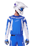 Alpinestars 2025 Fluid Haul Jersey, Motocross Jersey, Blue and White, worn with matching pants and gloves, white helmet with blue goggles, coordinated MX gear set for off-road riding
