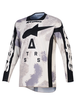 Alpinestars 2026 Racer Lahnd Jersey, camisola de motocross, camuflado de areia em cinzento e branco, com um grande logótipo A-star preto e letras estilizadas no peito, gola redonda e painéis laterais pretos, mangas compridas com a marca em branco, vestuário profissional de corrida off-road.