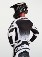 Alpinestars camisola Techstar Swan, camisola de motocross para homem, branca e preta, vista traseira, performance MX.