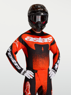 Alpinestars Techstar Swan, camisola de motocross para homem, vermelha e preta, ajuste atlético com pormenores brancos.