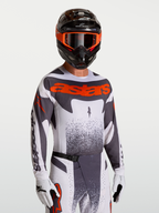 Alpinestars Techstar Swan, camisola de motocross para homem, cinzenta e vermelha fluo, perfurações a laser