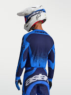 Alpinestars Techstar Swan, camisola de motocross azul e azul escuro com perfurações a laser respiráveis, vista traseira.