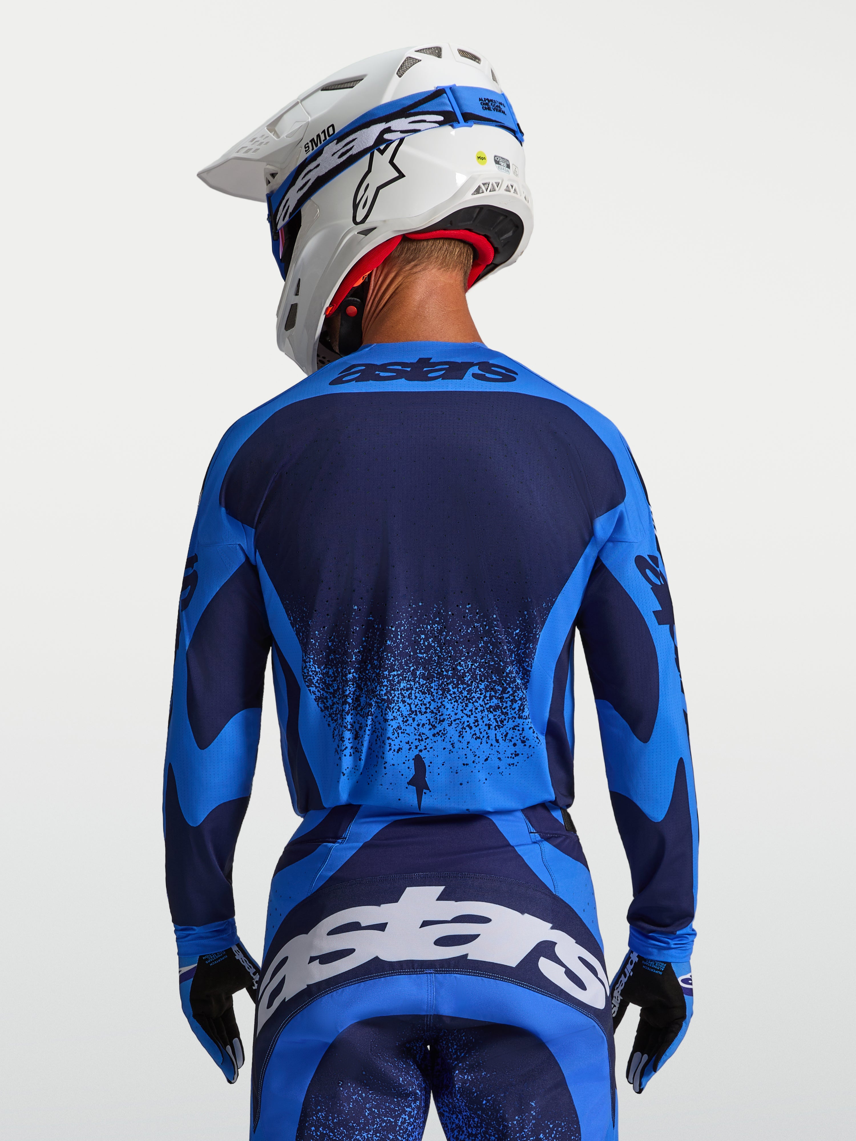 Camisola Alpinestars Techstar Swan, equipamento de motocross para homem, azul UCLA e azul escuro, com ajuste atlético.