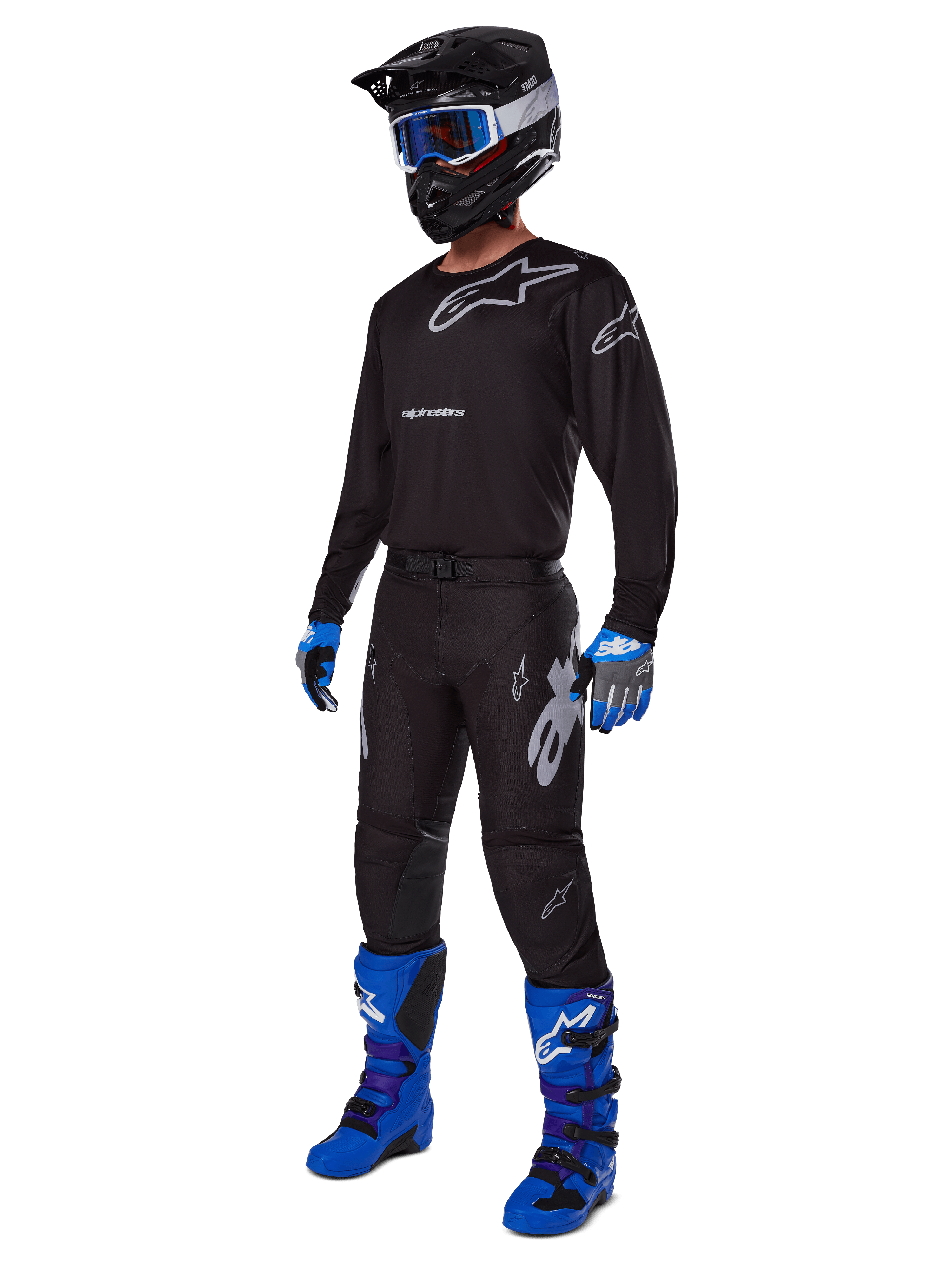2025 Racer Graphite Gear Set, complete motocross outfit, black and gray jersey and pants with silver logos, black helmet with blue-tinted goggles, blue and black gloves, bright blue boots, professional off-road racing gear