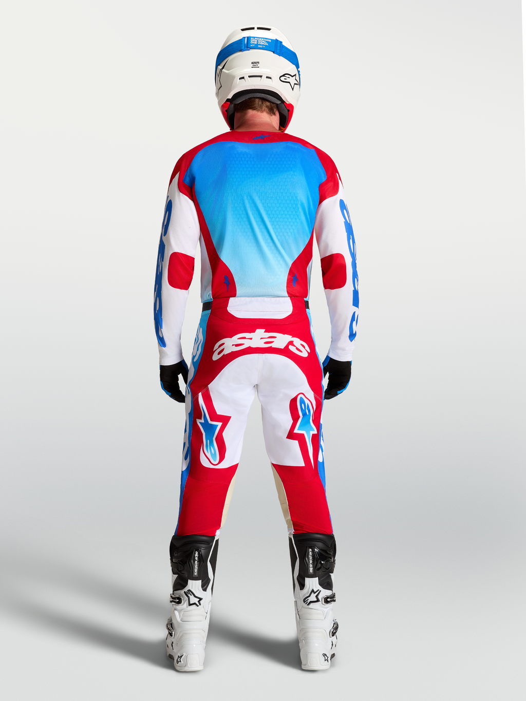 Alpinestars camisola Racer Hunt para homem, vermelha, branca e azul, motocross, vista traseira, com absorção de humidade.