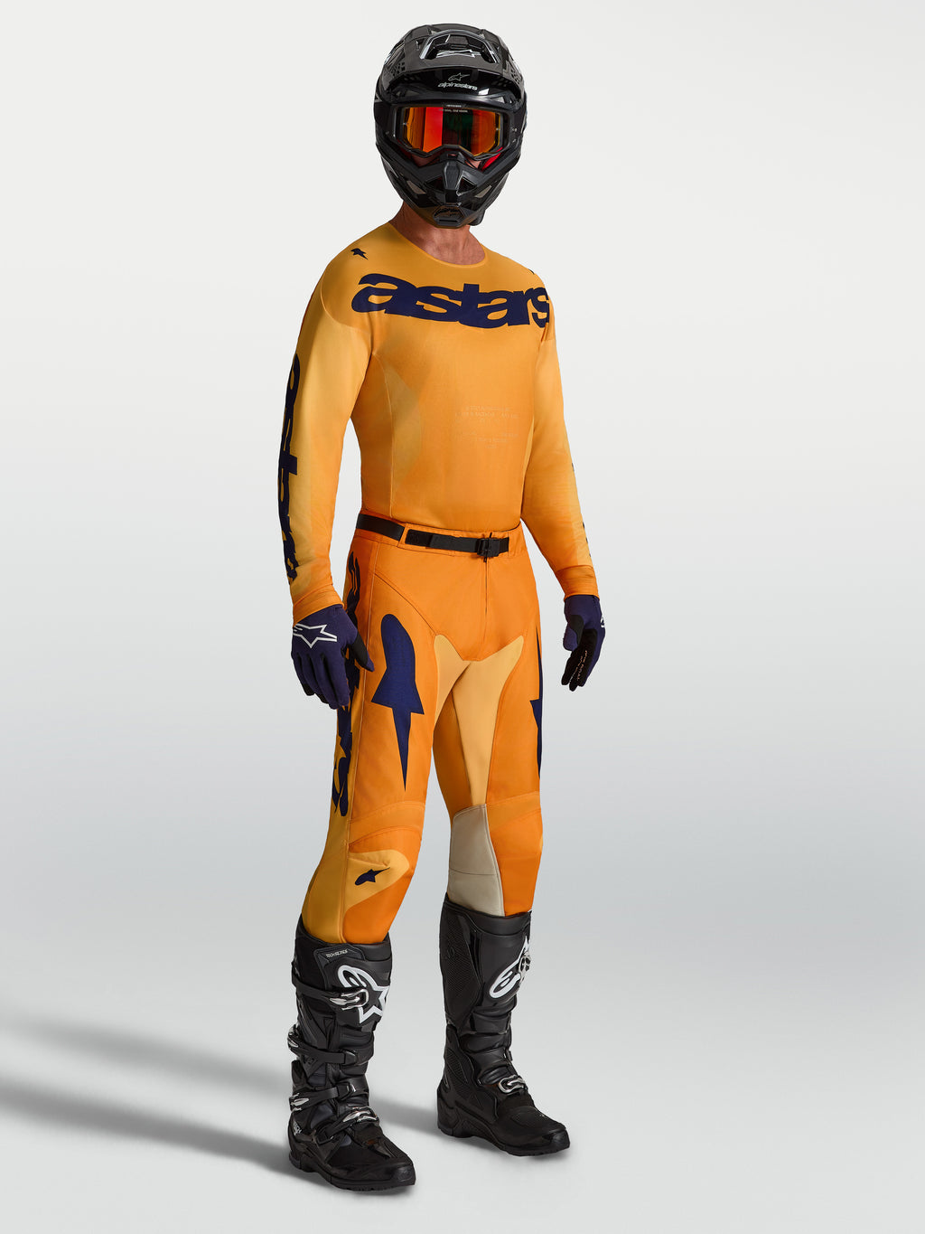 Alpinestars Racer Amber Gear Set 2027, conjunto de motocross para homem, laranja e azul profundo, camisola e calças.