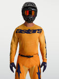 Camisola Racer Amber da Alpinestars, camisola de motocross para homem, laranja e azul escuro, em politecido respirável.