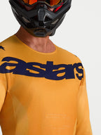 Alpinestars Camisola Racer Amber, camisola de motocross laranja e azul, tecido que absorve a humidade e logótipo no peito.