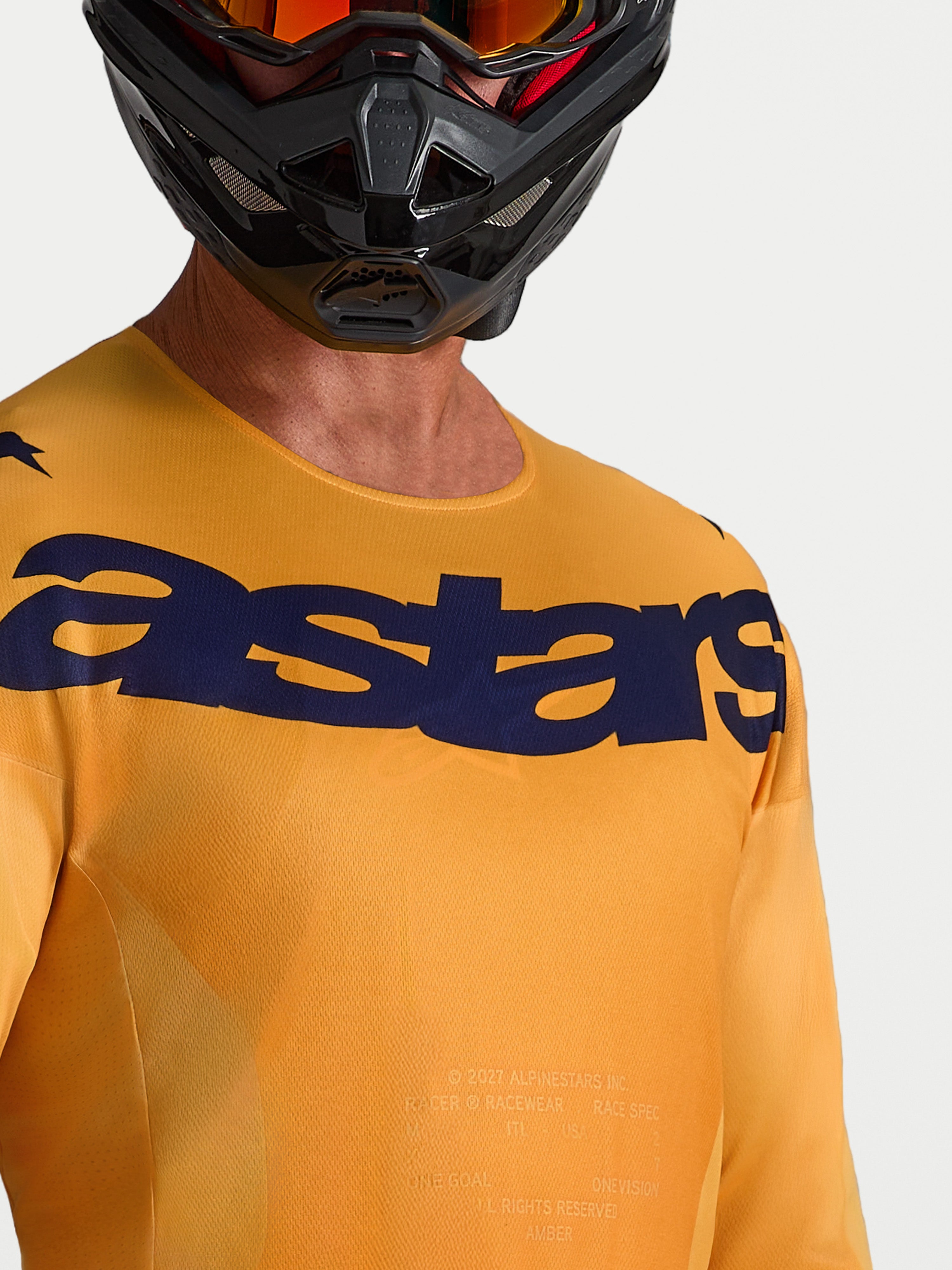 Alpinestars Camisola Racer Amber, camisola de motocross laranja e azul, tecido que absorve a humidade e logótipo no peito.
