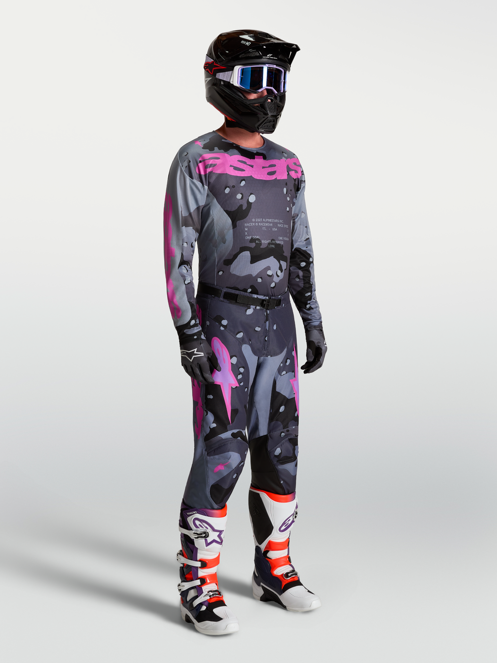 Alpinestars Racer Lone, conjunto de motocross para homem com camisola e calças, cinzento camuflado e roxo.