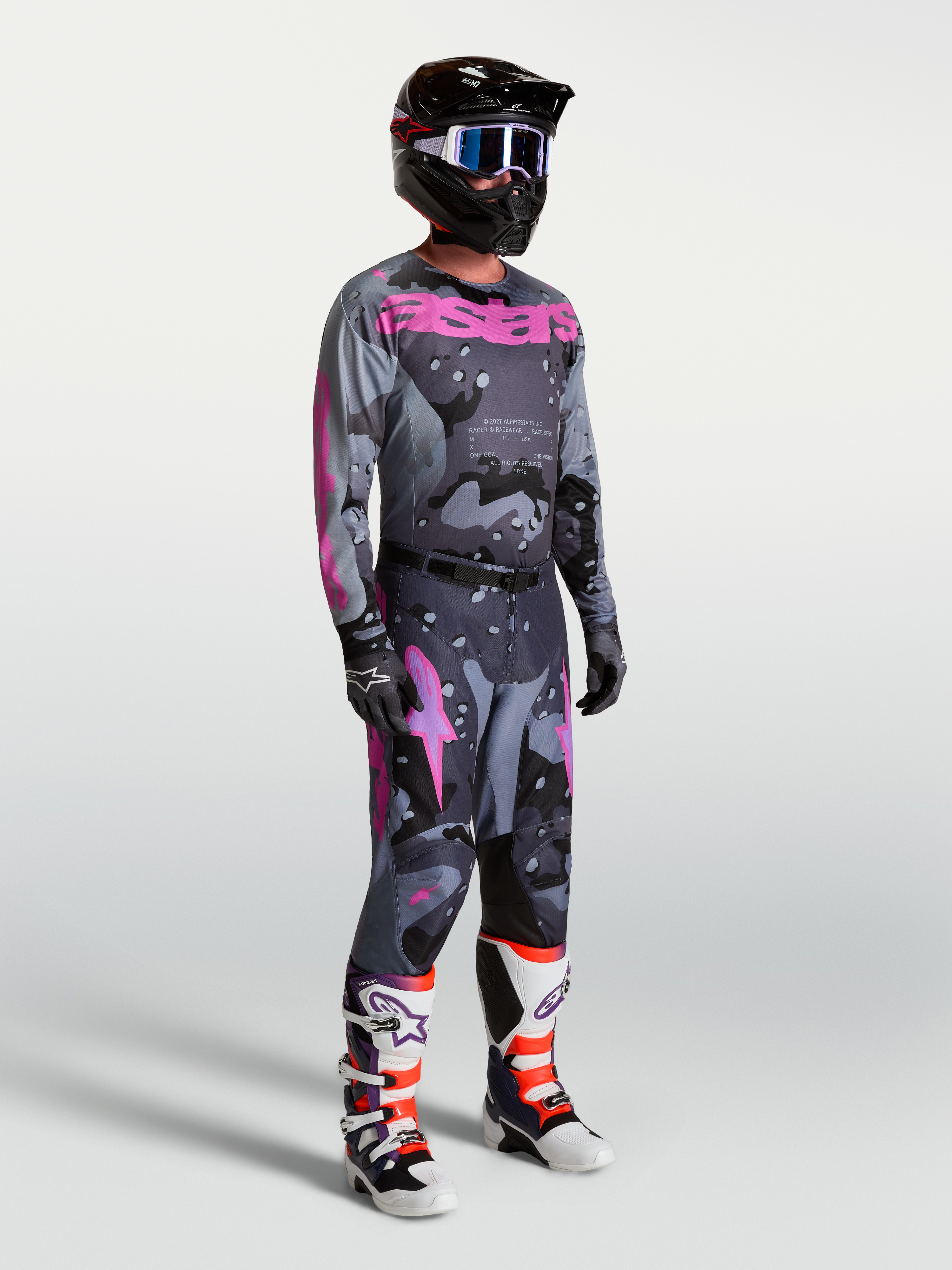 Alpinestars Racer Lone, conjunto de motocross para homem com camisola e calças, cinzento camuflado e roxo.